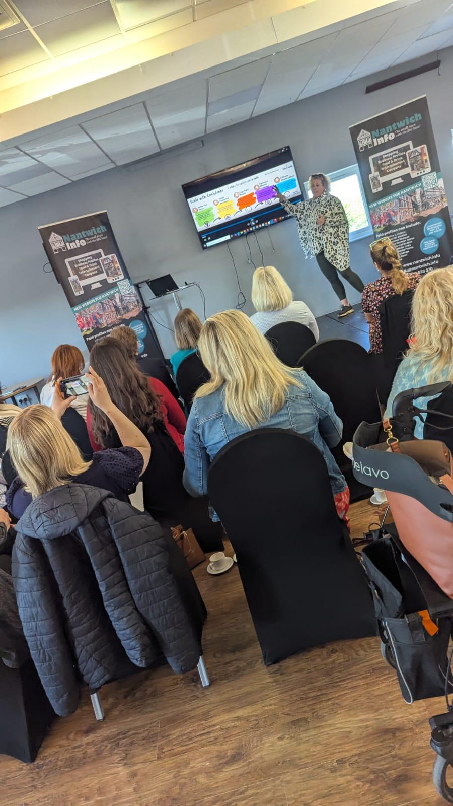 Anna presenting to an audience