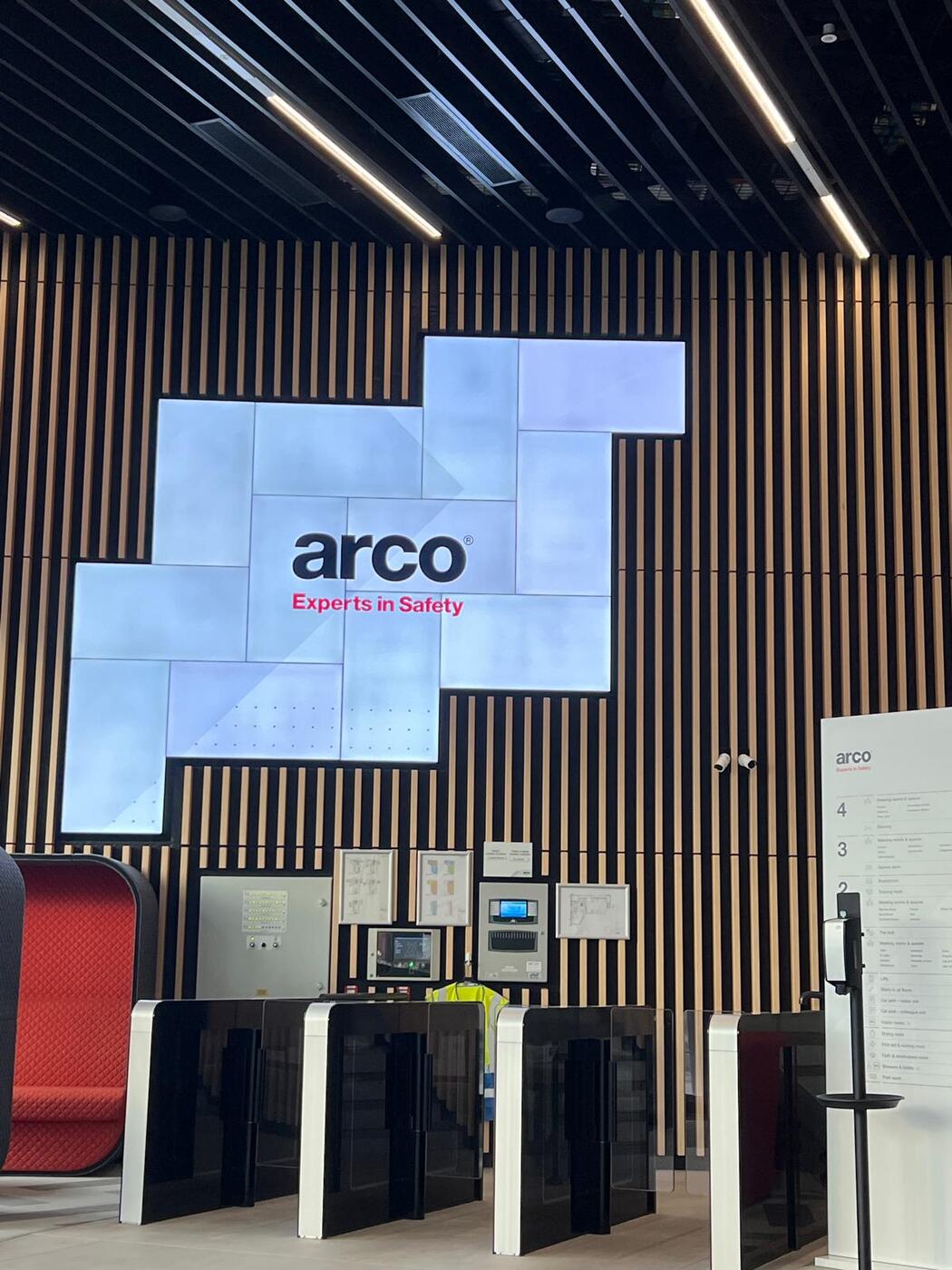A presentation screen on stage during a session with Arco.